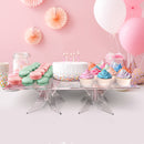 birthday cake and cupcakes in a clear square acrylic raised pastry stand